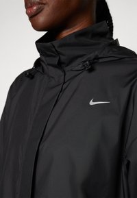 Nike Performance FAST - Windbreaker - black