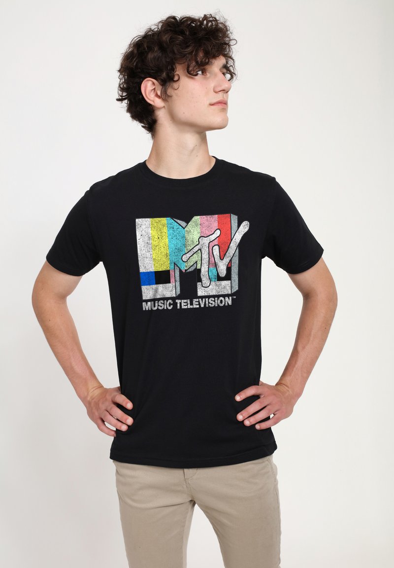 Black cotton t-shirt featuring a multicolored MTV logo and "MUSIC TELEVISION" text in gray. Short sleeves, crew neckline. Smooth texture.