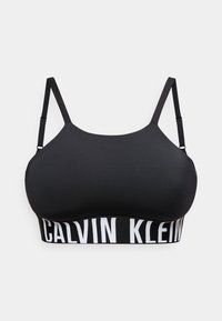 Μαύρο μπουστάκι Calvin Klein με ρυθμιζόμενους λεπτούς ιμάντες και φαρδιά ελαστική ταινία με έντονη λευκή σήμανση.