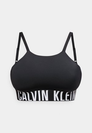 Μαύρο μπουστάκι Calvin Klein με ρυθμιζόμενους λεπτούς ιμάντες και φαρδιά ελαστική ταινία με έντονη λευκή σήμανση.
