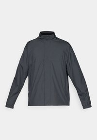 Veste gris foncé avec col montant, manches longues et poignets élastiques. Texture lisse, design minimaliste sans fermetures ni motifs visibles.