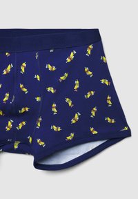 Boxer in blu navy con stampa di personaggi a forma di banana gialla. Realizzati in tessuto morbido, presentano una vita elastica e una fodera interna a contrasto.