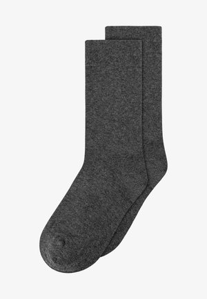 Gray cotton socks with a smooth texture, a reinforced toe, and ribbed cuff. They are mid-calf length and feature a classic, plain design.