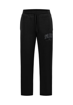 Zwarte casual sweatpants met elastische tailleband, trekkoord, zijzakken en de tekst "Smilodon Essential Sportswear" op de linker dij.