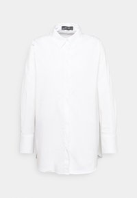 Camicia bianca a maniche lunghe con bottoni, realizzata in tessuto liscio. Presenta un colletto classico, polsini allungati e una sagomatura dritta con fessure laterali.