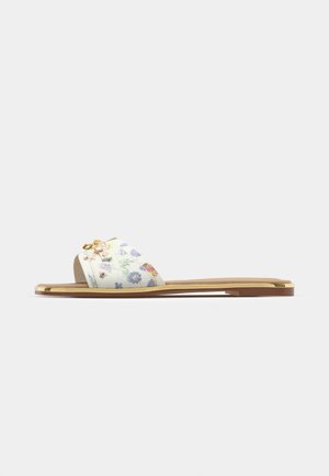 Floral slide sandal with a white textured upper, featuring colorful flower patterns and a small gold accent on the strap. Flat brown sole.