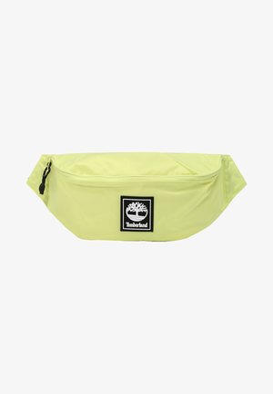 Heldere groene Timberland heuptas met een voorzak met rits en een zwart logo label met een boom en de merknaam.