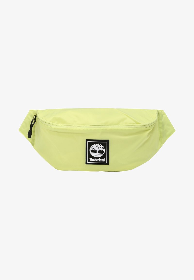 Světle zelená ledvinka Timberland s přední kapsou na zip a černou nášivkou s logem, která zobrazuje strom a název značky.