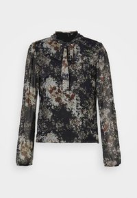 Blusa nera trasparente a maniche lunghe con stampa floreale e colletto a fiocco annodato.