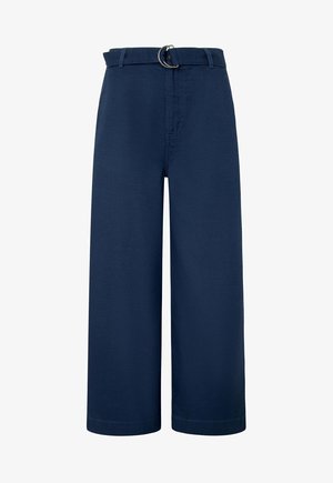 Tumesinine laiad pükseerite valmistatud puuvillast, millel on hõbedane rõngaga vöö, esi-taskud ja sirge siluett.