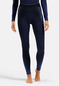 Navyblaue Leggings mit einem strukturierten Muster, einem hohen Bund mit schwarzem Akzent und einem figurbetonten Design.