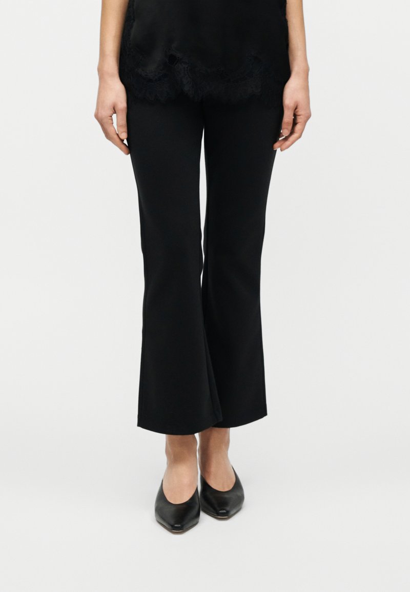 Calvin Klein SPACER FIT FLARE PANT - Kalhoty - black