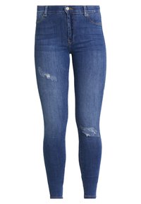 Hubené džíny v tmavě modrém denimu s vybledlým wash. Mají roztržení na kolenou. Klasický design s pěti kapsami a kovovým zapínáním.