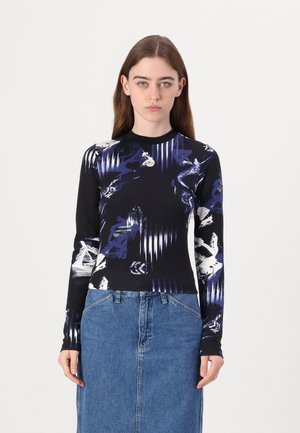 Long-sleeve top in black with blue and white abstract patterns, round neckline, featuring a small accent detail at the collar.