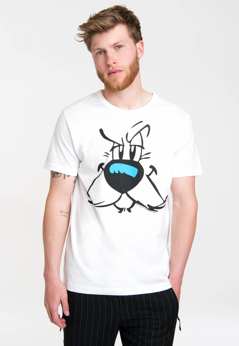 White cotton t-shirt featuring a large cartoon dog face graphic in black and blue. Short sleeves and a crew neckline.