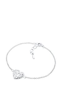 Silverarmband med ett ihåligt hjärta som charm, med intrikata utskärningar, länkade med kedja och enammar-klammer samt förlängningskedja.