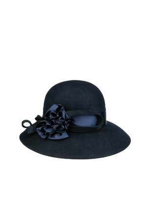 Navy blue felt wide-brim hat with a rounded crown, decorated with a matching ribbon and large fabric flower on the side.