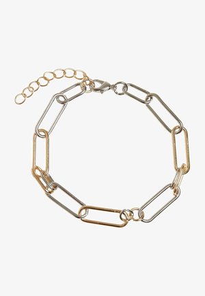 Fém lánc karkötő, amely arany és ezüst színű váltakozó szemekből áll. Kapcsolóval és állítható hosszabbító lánccal rendelkezik a méret állításához.