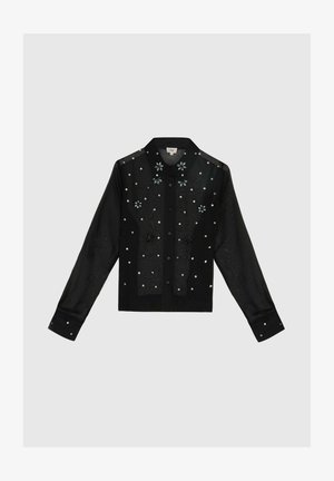 Chemise noire translucide à boutons, ornée de broderies florales et de sequins argentés, avec des manches longues et un col classique.