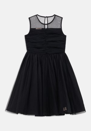 Black dress with a fitted, ruched bodice and a tulle skirt. Sleeveless design with a sheer neckline and back keyhole closure.
