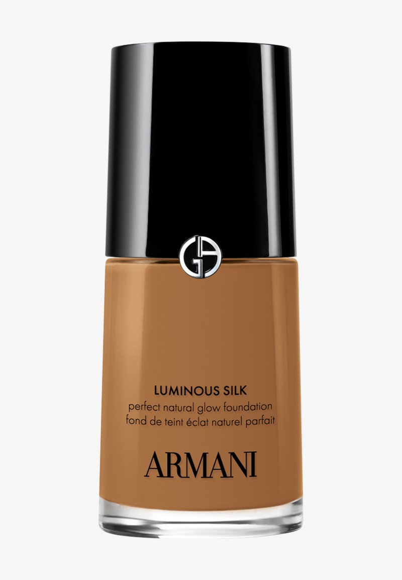 Bottiglia di fondotinta Armani Luminous Silk effetto naturale luminoso con tappo nero e liquido visibile color abbronzatura media all'interno.