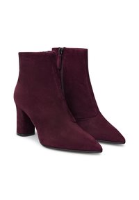 Paio di stivali alla caviglia da donna in suede viola scuro con punte appuntite, suole a blocco e zip laterali.