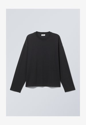 Schwarzes Langarm-T-Shirt aus weichem Stoff. Mit Rundhalsausschnitt und lässiger Passform. Nahtdetails an den Schultern, minimalistisches Design.