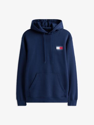 Tumedat sinise värvi kapuutsiga pusa, millel on ees kanguru tasku, reguleeritav kapuutsiköis ning väike logo seepärast punase, valge ja sinise värviga.