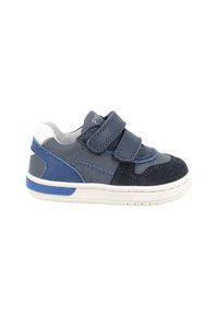 Scarpa da bambino in blu navy e nero con suola bianca, due cinturini regolabili in Velcro e dettaglio blu sul tallone e sulle cuciture.