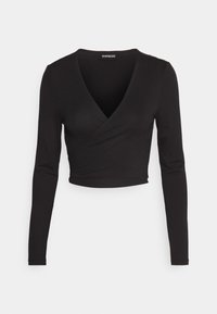 Svart långärmad omslagstopp i slät, stretchig tålighet med djup V-ringning och kort nederkant. Ingen synlig hårdvara eller mönster.