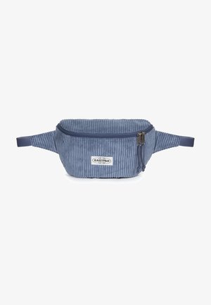 Blue corduroy Eastpak waist bag with two zipper pulls and adjustable straps on a white background.