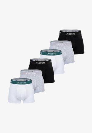 Set of six pairs of men's boxer briefs in black, white, gray, and a dark green waistband with "LACOSTE" logo. Cotton and stretchy material.