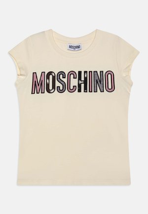 Cream-colored short-sleeve t-shirt featuring "MOSCHINO" text in varied fonts and colors, including pink, brown, and black. Soft cotton material.