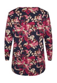 Maglietta a maniche lunghe di color navy con un motivo floreale multicolore che presenta accenti in rosa, crema e marrone. Tessuto morbido con un design a vestibilità rilassata.