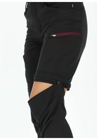 Black hiking pants with zip-off legs, featuring a side pocket with a maroon zipper. Made of soft, smooth fabric with a comfortable fit.