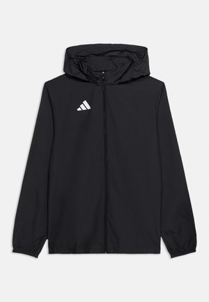 Zwarte lichtgewicht capuchonjas met ritssluiting aan de voorkant en wit Adidas-logo op de linkerborst, met elastische manchetten en geen zichtbare zakken.