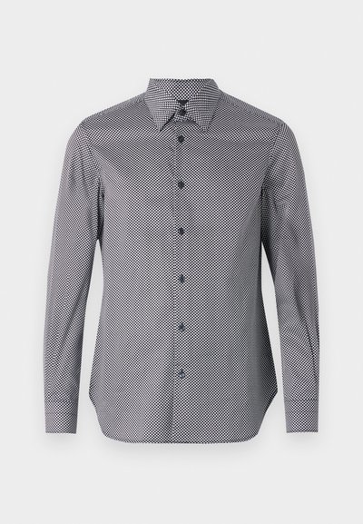 Long-sleeve button-up shirt in black and white geometric pattern. Features a pointed collar, blue buttons, and a curved hem.