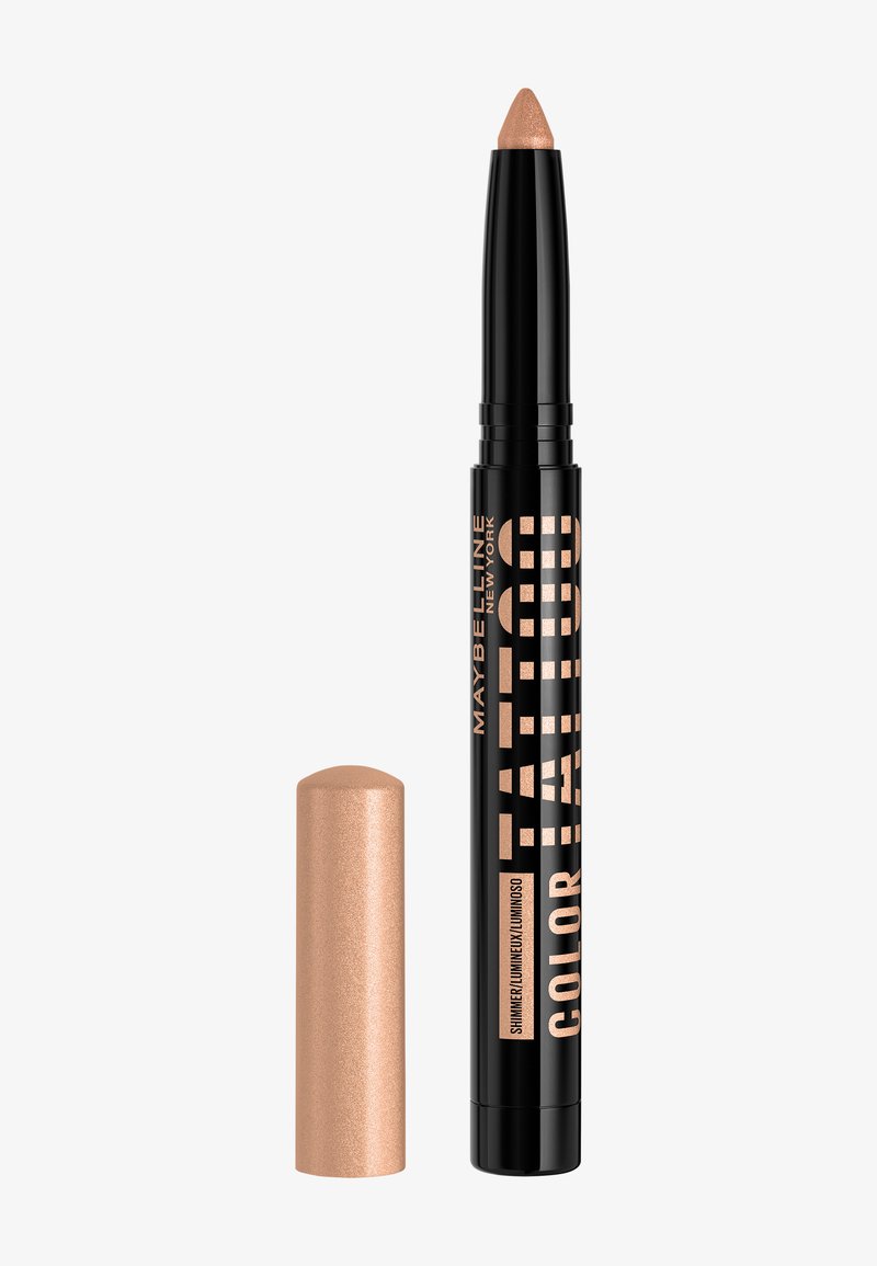 Crayon eyeliner Maybelline Tattoo Color, noir avec une pointe nacrée nude, capuchon à côté sur fond blanc.