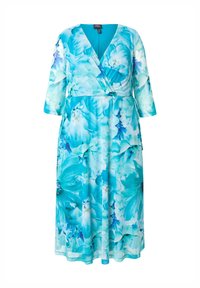 Lång, omslagsklänning i ett livfullt blått blommönster. Har trekvartslånga ärmar och en djup V-ringning. Lätt, flödande tyg.