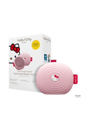 Brosse faciale sonique Hello Kitty rose avec surface rainurée et étiquette rouge, présentée avec un emballage blanc comportant le visage de Hello Kitty et les détails du produit.