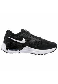 Sneakers Nike Air Max in bianco e nero con tomaia in mesh, design elegante, dettagli in suede strutturato, suola in gomma e ammortizzazione ad aria visibile.