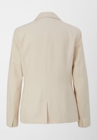 Beige blazer met een op maat gemaakt ontwerp, met geknipte revers en een achterventilatie. Gelaagd stof met een subtiel patroon en gestructureerde mouwen.