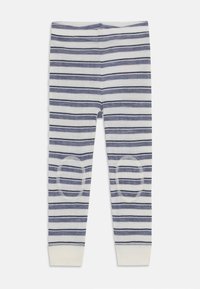 Stripete leggins i hvit og marineblå, med ribbet midje og kneputer. Mykt stoff og tettsittende design, med en stram ankelkant.