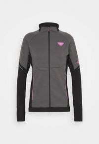 Veste de sport grise avec des manches noires et des accents roses. Elle présente un col montant, une fermeture éclair complète et des poches latérales zippées. Texture lisse.