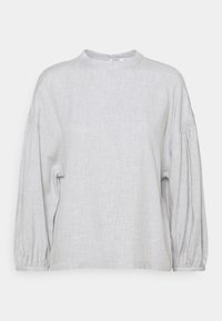 Helle graue Bluse mit langen Ärmeln aus strukturiertem Stoff. Mit hochgeschlossenem Kragen, dezent gerafften Schultern und elastischen Manschetten.
