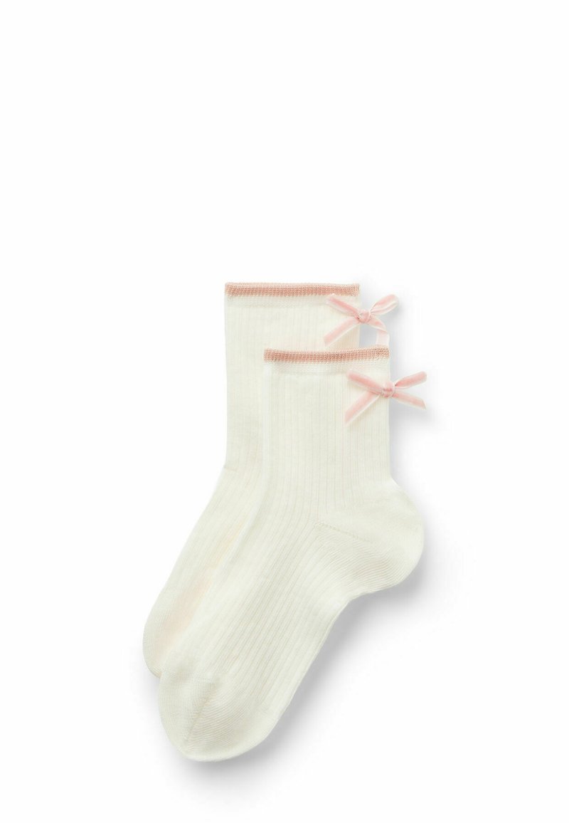 Hvide ribbede sokker med lyserøde detaljer og små sløjfer på siderne. Fremstillet i et blødt materiale, der har et komfortabelt ankel-længde design.