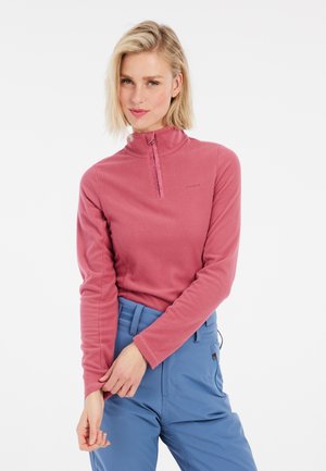 Fleece pullover in zacht roze met een hoge kraag en een halve rits. Lange mouwen, textuurstof, gecombineerd met lichtblauwe broek.