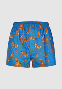 Boxer shorts featuring a blue background with an all-over print of orange cartoon tigers and green foliage. Elastic waistband.