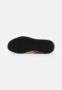 Black rubber shoe sole with a textured pattern, featuring a wide base and a smooth curve. Contrasting yellow and white accent on the side.