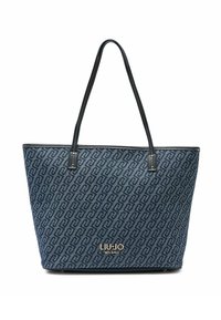 Borsa tote blu navy con tessuto decorato da forme intrecciate, manici in pelle nera e logo dorato in basso.